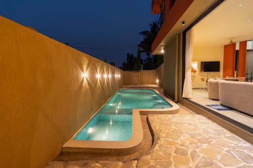 Malavli Villa | SaffronStays Ivory and Orange