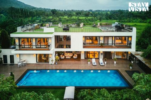 Karjat Villa | StayVista at The Amaryllis with Heated Pool & Projector Set-Up