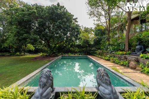 Parshwapuram Villa | StayVista's House Of J - Embrace Leisure with Lawn, Pool, and Gazebo