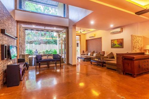 Kune Village Villa | StayVista's The Happy Hive - Cozy rooms and a pool for a delightful stay