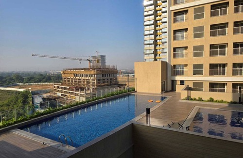 Gandhinagar Apartment | 2-bedroom apartment in serene GIFT city with AC, Pool, Gym, Family/Business Stay