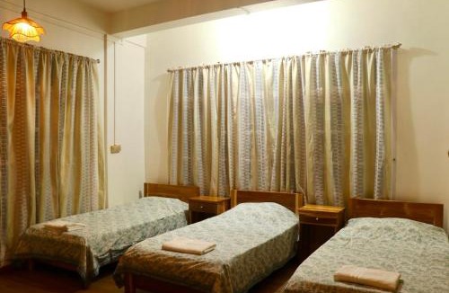 Aizawl House | Casa Zo The Trio room with three single beds & balcony