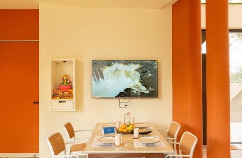 Malavli Villa | SaffronStays Ivory and Orange