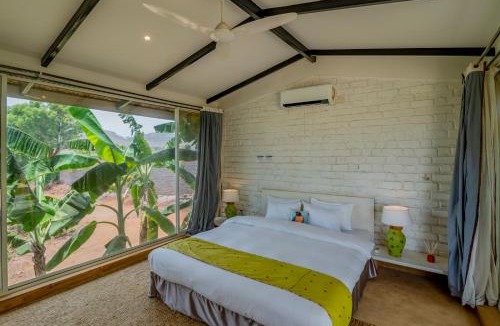 Nashik Villa | SaffronStays Onellaa, Nashik - infinity pool villa surrounded by a vineyard
