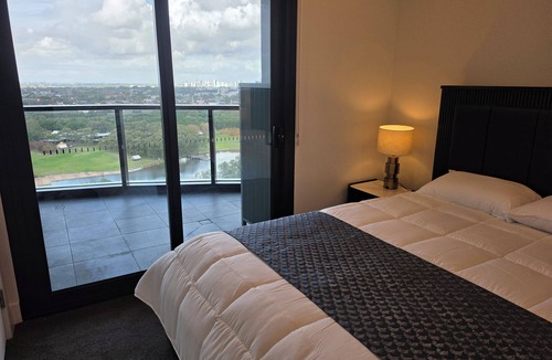 Sydney Olympic Park Apartment | Sky-High 3BR Oasis: City/Park View & Two Secure Parking Spots
