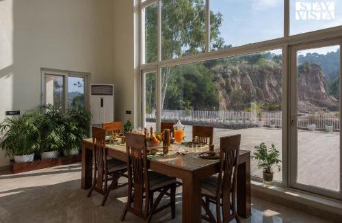 Kishangarh Villa | StayVista at Golden Lark with Wi-Fi, Pool & Lawn
