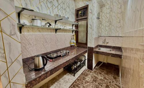Sainik Farm House | The Raveesh E24 - 2BHK Serviced Apartment
