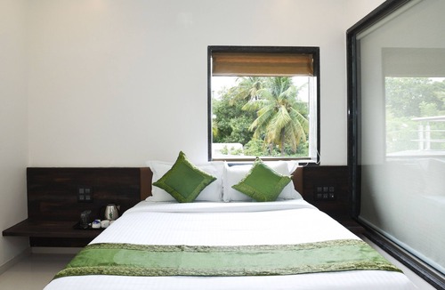 Nigdi Hotel | Treebo Malhaar Regency