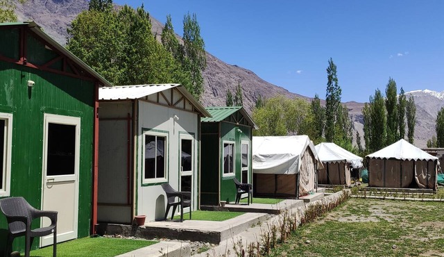 Cozy tents and huts surrounded by the mountains and nearby to riverside Nubra.