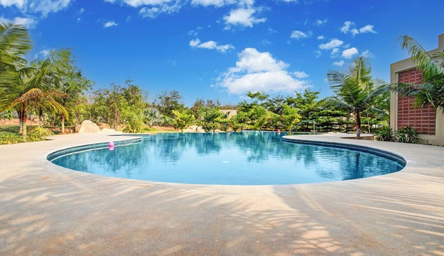 ELIVAAS Urvi Resort | Eco-Luxury Getaway with Pool in Chikkellur