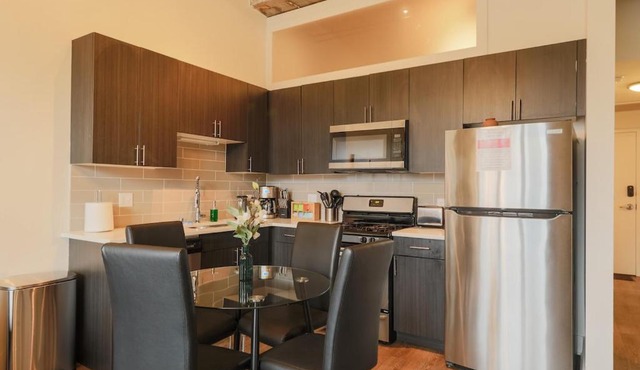 Spacious 2BR South Loop Suite with Skyline View, Optional Parking and Gym Access Close to McCormick Place, Grant Park, Museum Campus & CTA Lines in Chicago