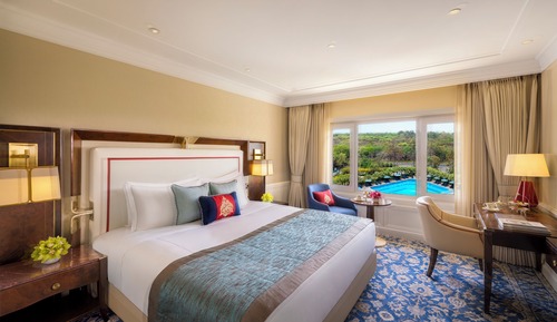 Superior Room King Bed Forest and Pool View