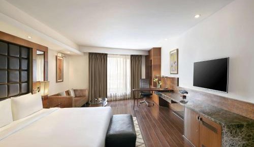 Business Class with Happy Hours 01:00 PM to 06:00 PM 1+1 , Airport Transfers and Free Pick up and drop to Worldmark Aerocity (subject to car availability)